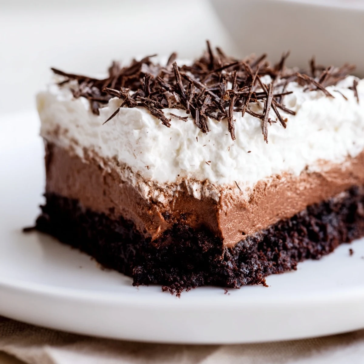 This comforting Mississippi Mud Pie features a rich brownie base, perfect for sharing and enjoying.