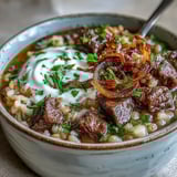 Hearty Persian-inspired Beef Barley Soup with tender beef, lentils, beans, and fresh herbs for a cozy meal.