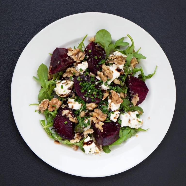 Dressed in a glossy balsamic vinaigrette, this Roasted Beet Goat Cheese Salad showcases ruby red beets, white goat cheese crumbles, and earthy walnuts, perfect for a healthy American lunch.