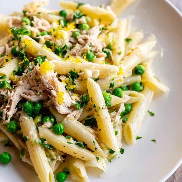 Freshly tossed Lemony Tuna Pasta Salad with al dente pasta, bright lemon zest, crisp red onion, and a drizzle of olive oil.
